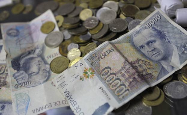 Billetes y monedas de peseta.